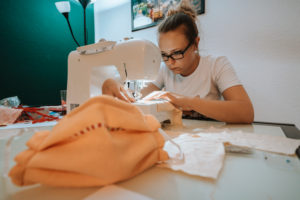 Woman sewing face mask for corona covid pandemic with sewing machine, Woman sewing face mask for corona covid pandemic with sewing machine,